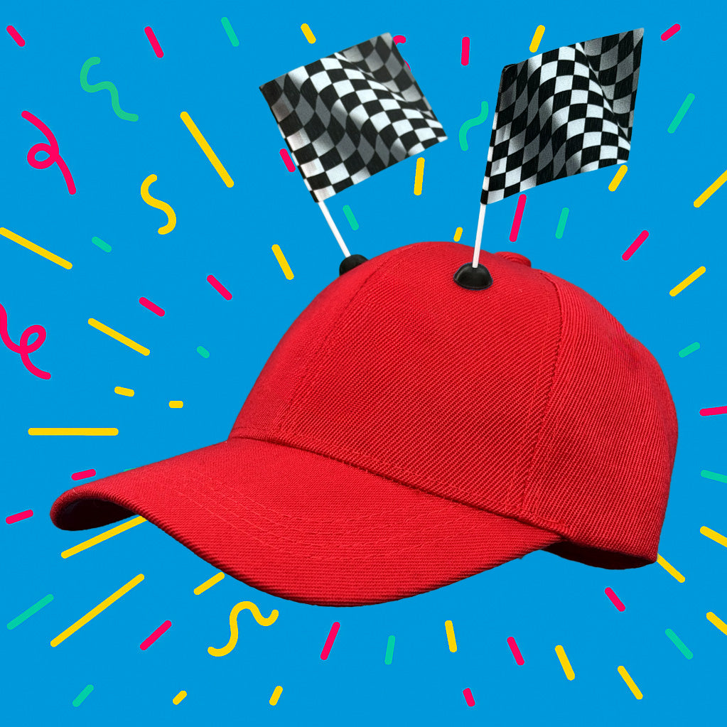 Red baseball cap featuring two Checkered race flag CapFlags installed, showing the versatile mounting system against a blue background