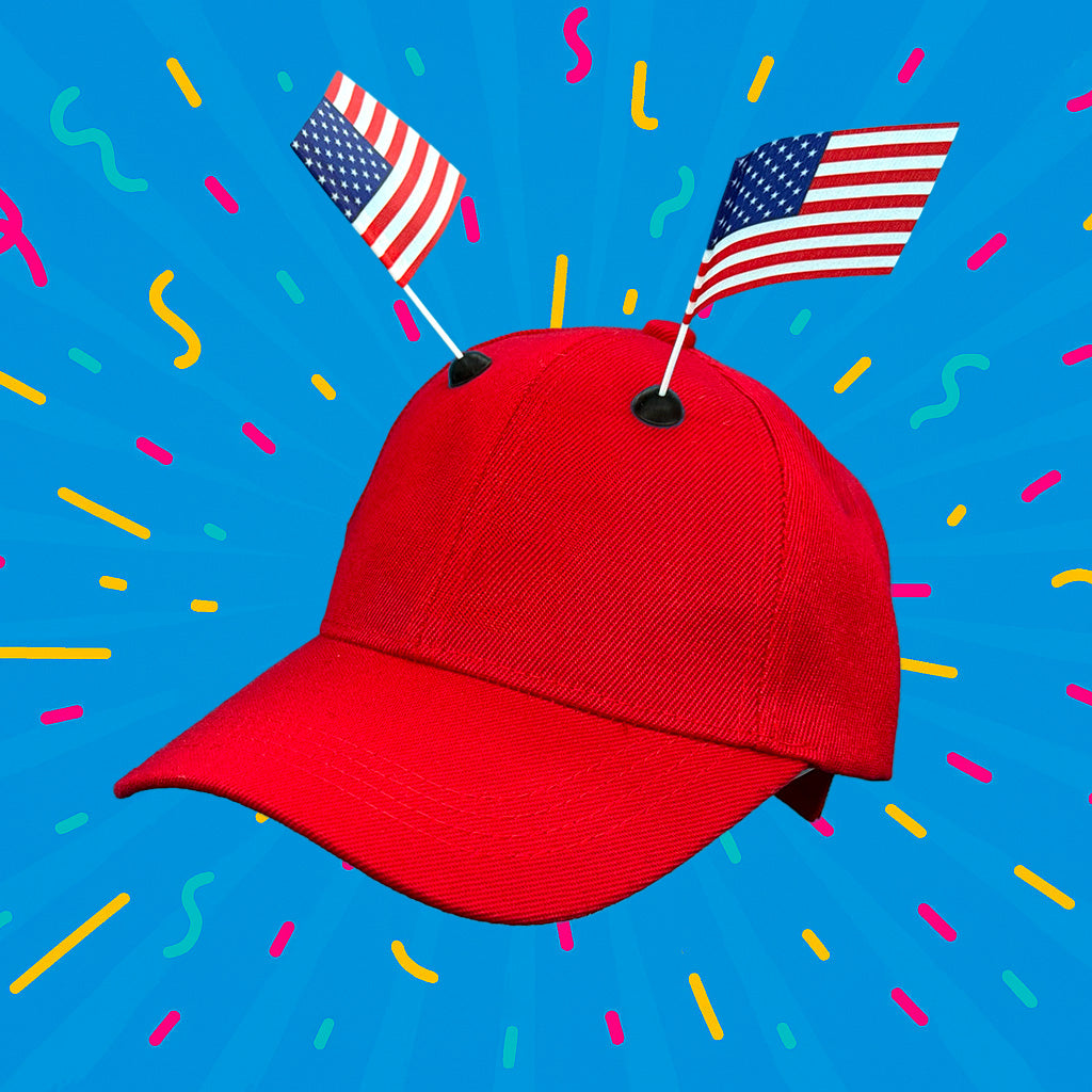 Red baseball cap featuring two USA CapFlags installed, showing the versatile mounting system against a blue background
